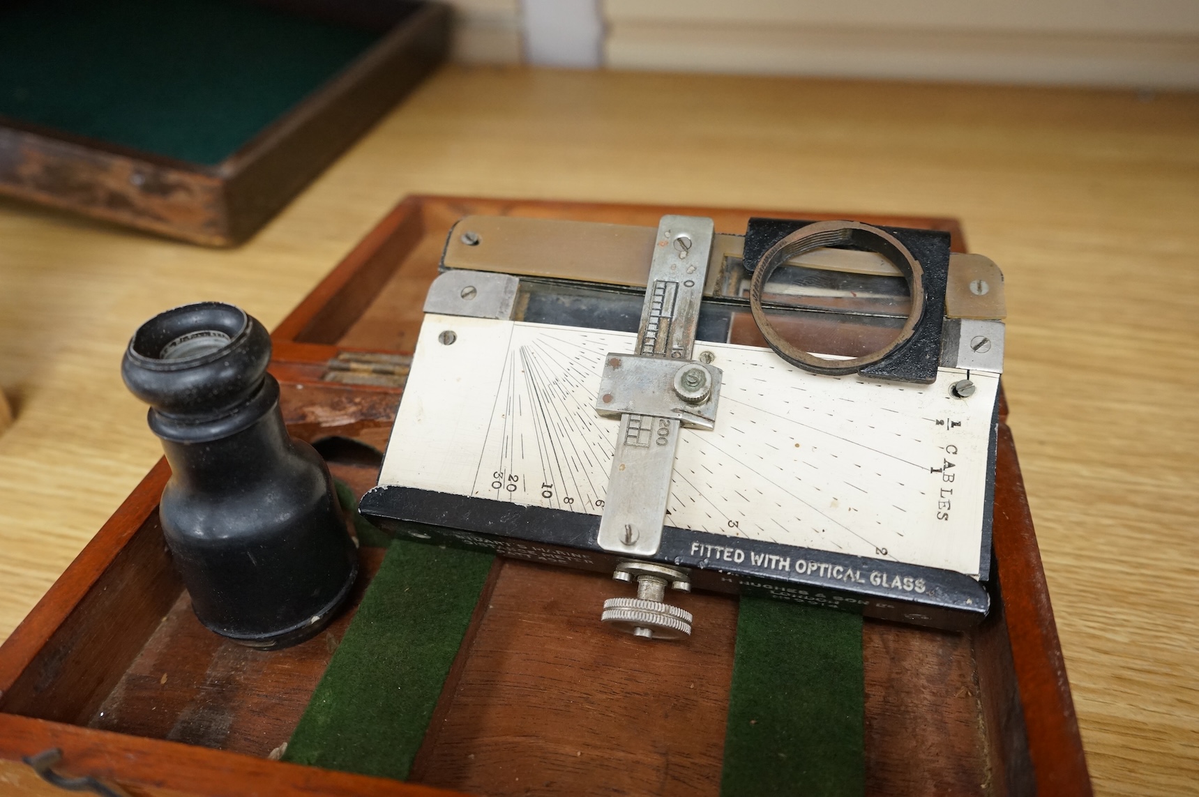 An early 20th century teak cased Stuart's Distance Meter and a late 19th century mahogany cased ‘Capt. Field’s Improved’ protractor by Gieves Ltd., 21 Old Bond Street W.1.
